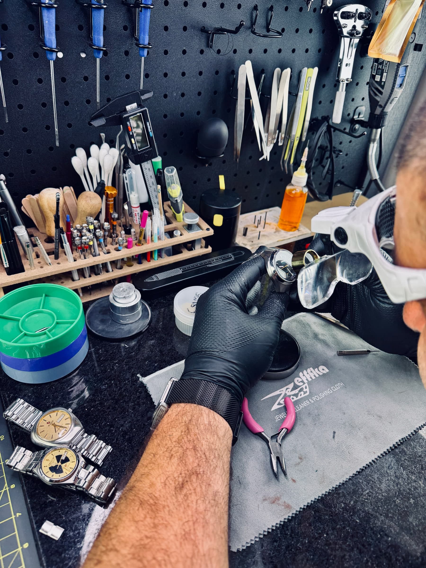 Alpha Gear Lab — inspecting a watch up close